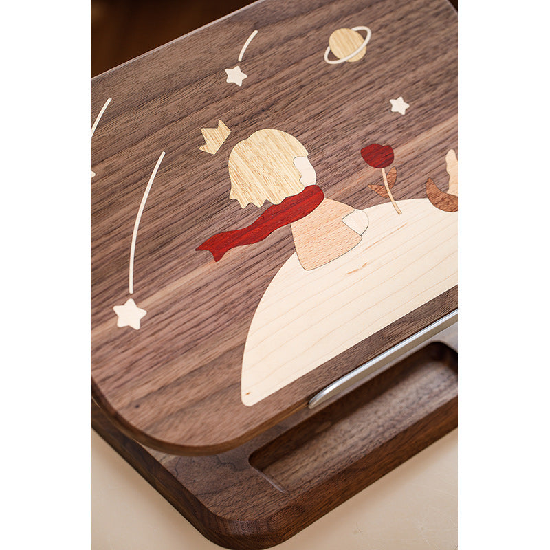 The Little Prince reading stand is made of solid wood and can be raised, lowered and extended